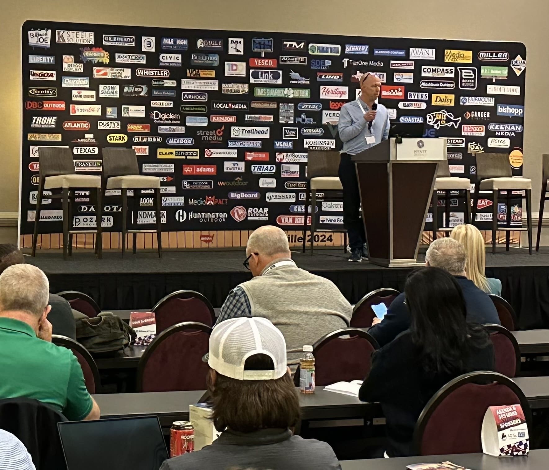 Shawn Whistler giving a talk at a billboard conference in louisville kentucky